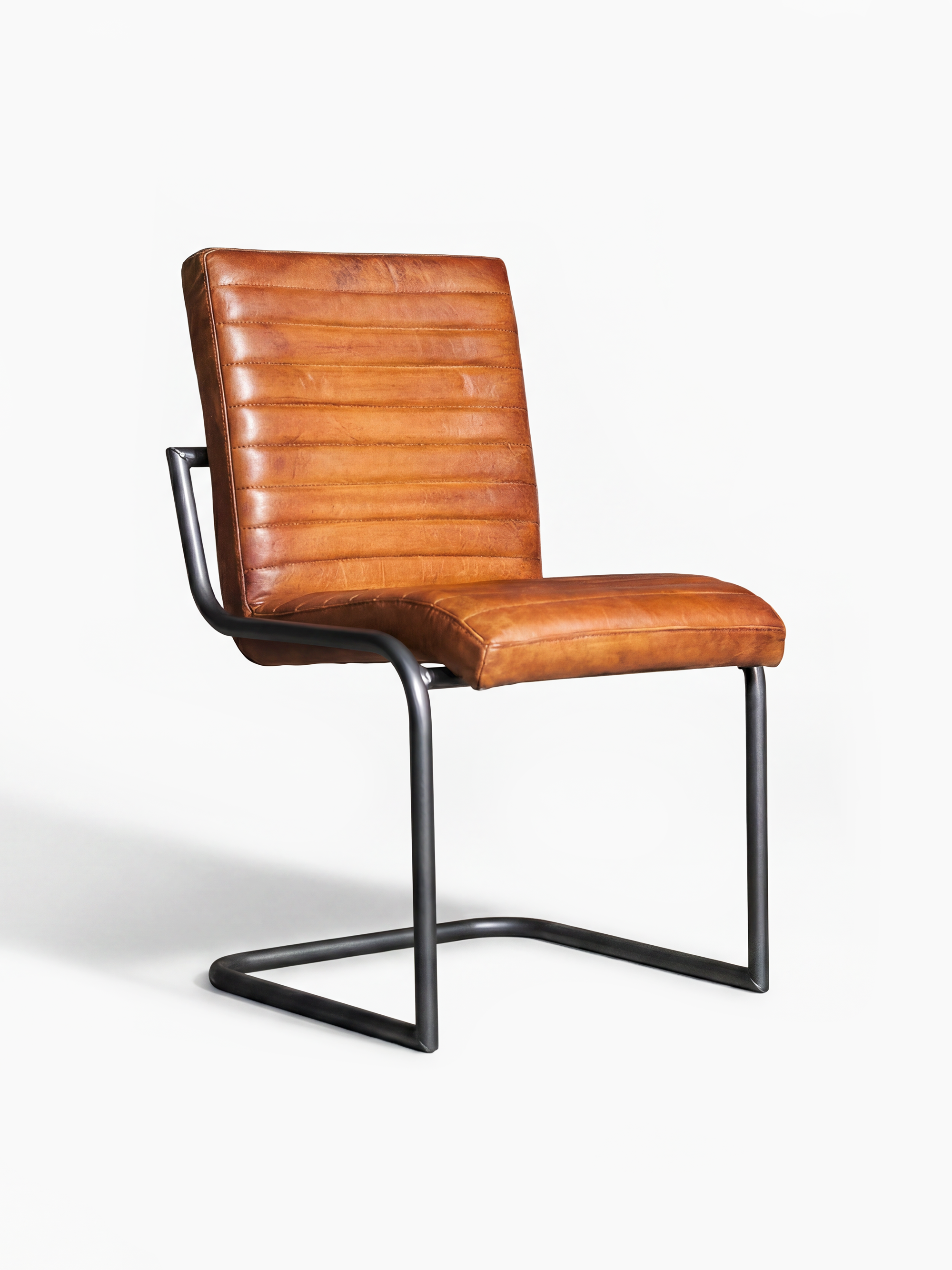 Eleganter Freischwinger Stuhl SINATRA ohne Armlehne aus Leder in Cognac